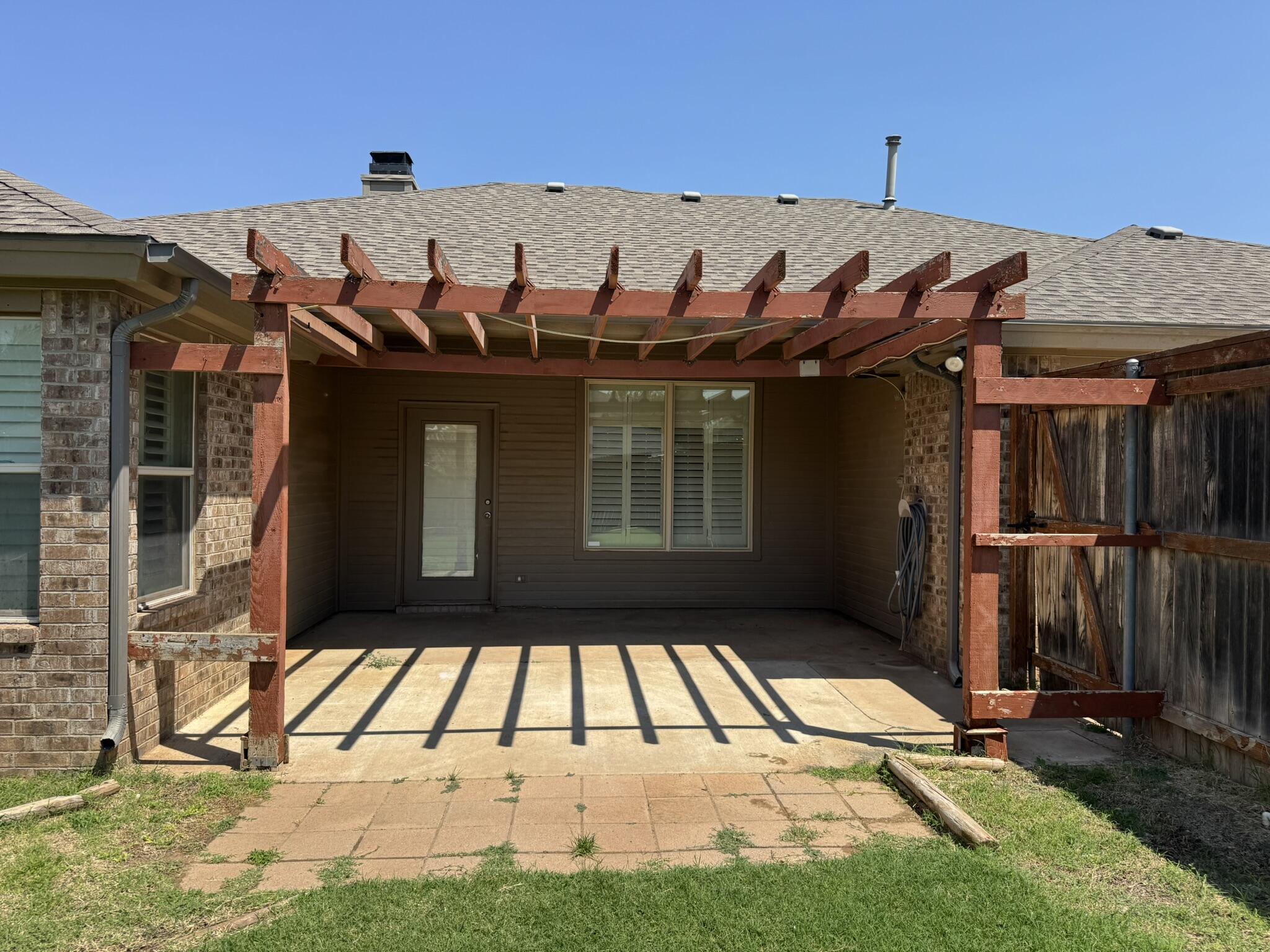 5027 Itasca Street Lubbock, TX 79416 - Photo 19 of 22 a view of a house with a door