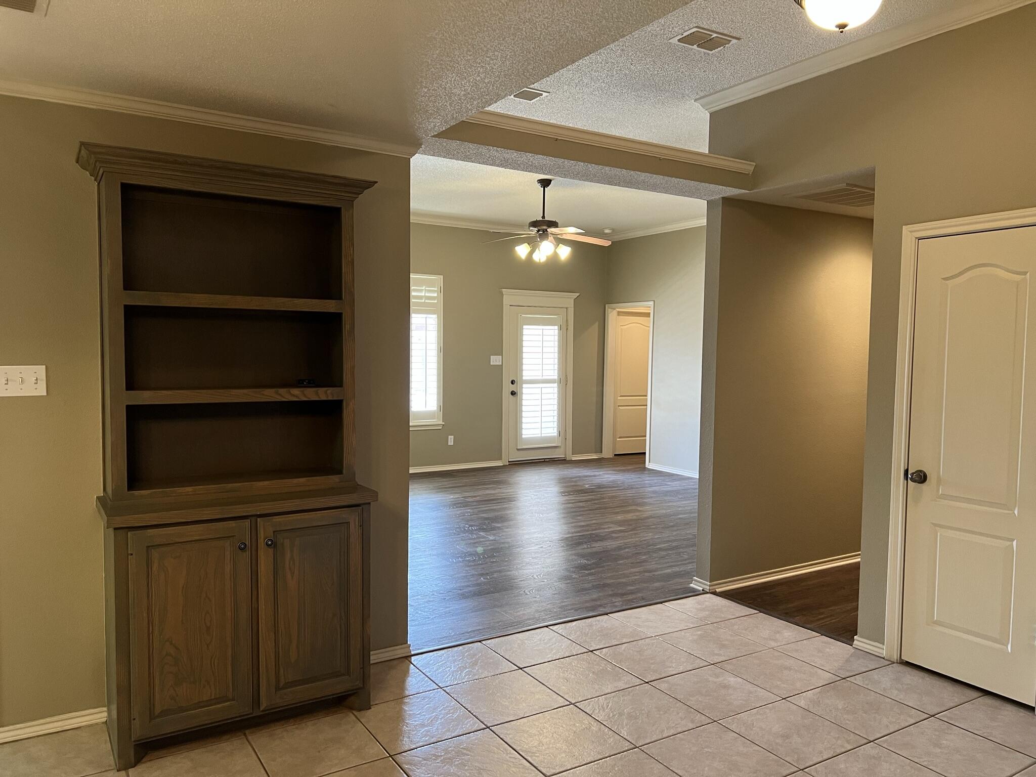 5027 Itasca Street Lubbock, TX 79416 - Photo 4 of 22 a view of a hallway with closet
