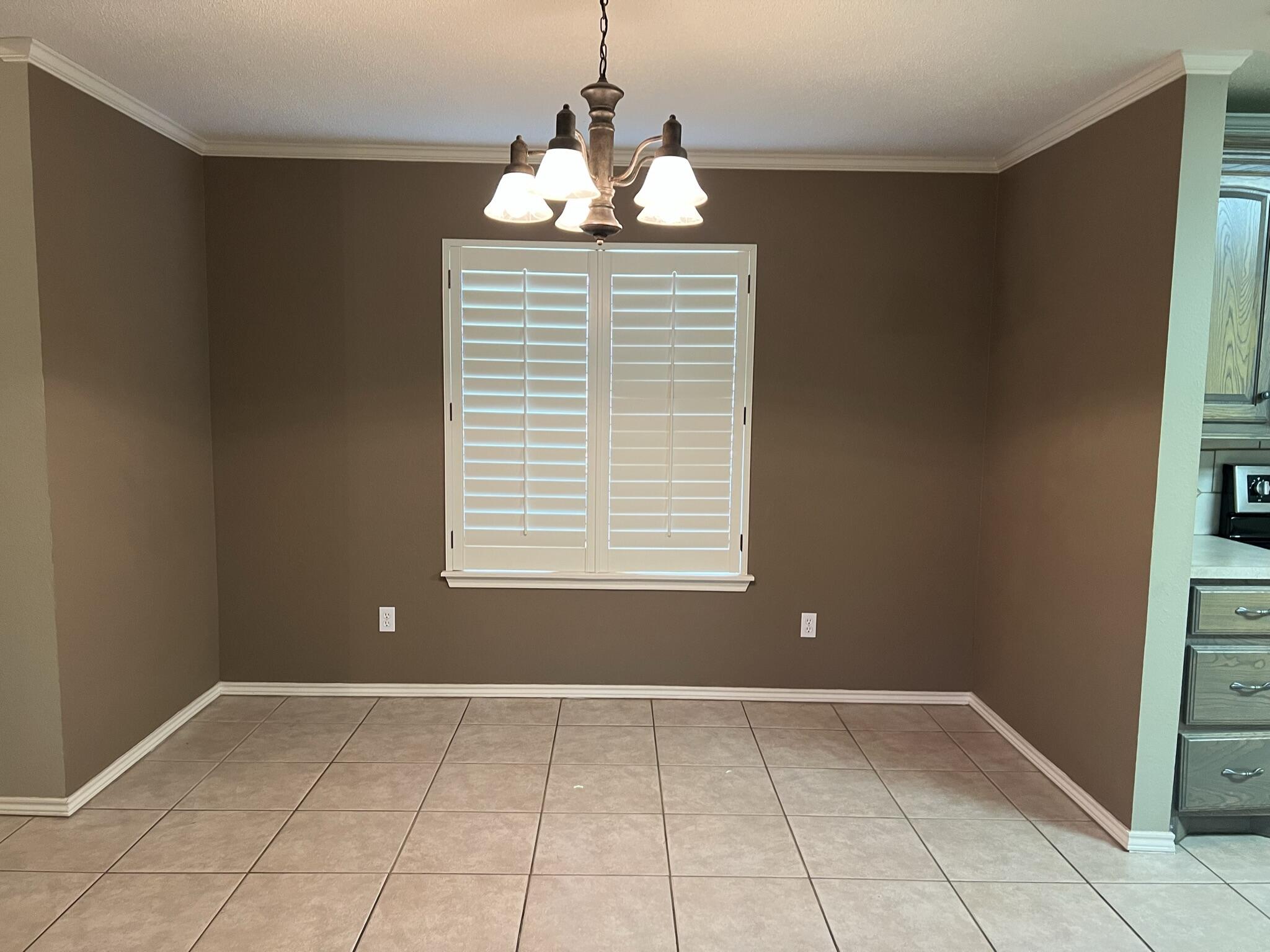 5027 Itasca Street Lubbock, TX 79416 - Photo 8 of 22 a view of an empty room with a window