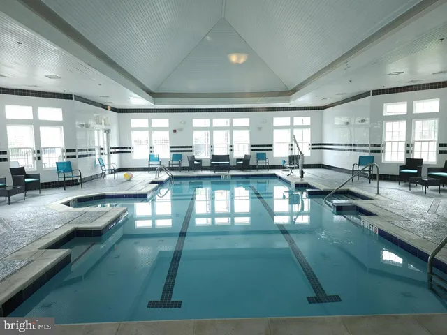 a large white kitchen with lots of counter top space