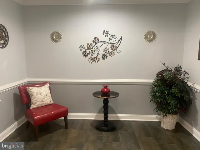 a view of entryway with livingroom and potted plant