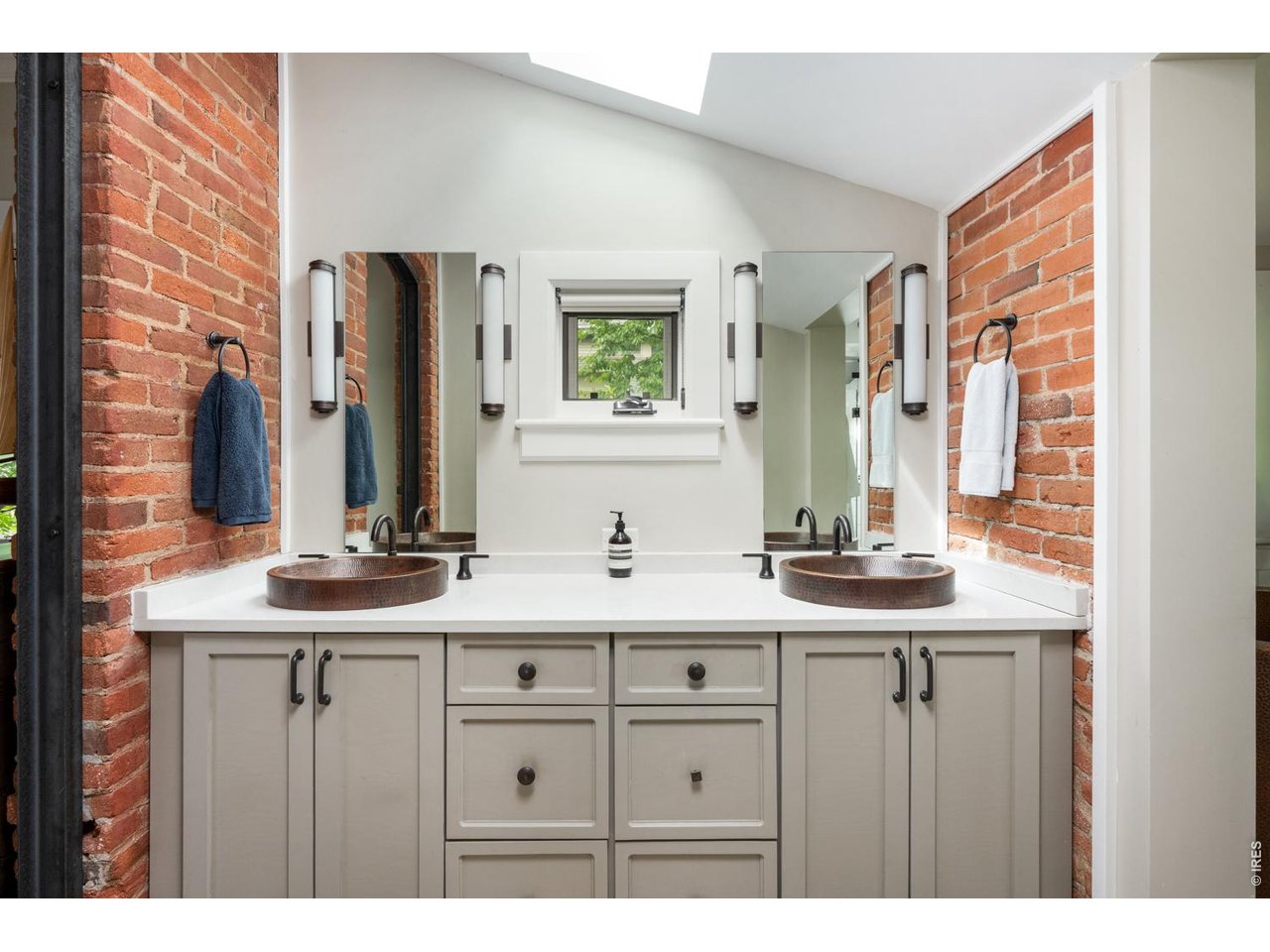 615 Spruce Street Boulder, CO 80302 - Photo 24 of 49 a bathroom with a double vanity sink and a mirror