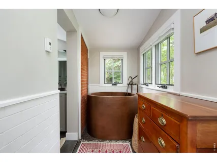 a bathroom with a bathtub and a sink