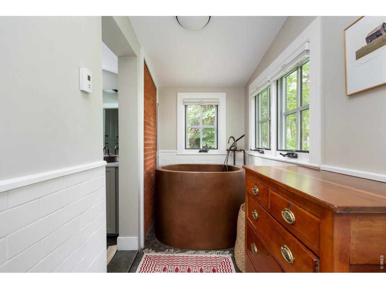 615 Spruce Street Boulder, CO 80302 - Photo 26 of 49 a bathroom with a bathtub and a sink