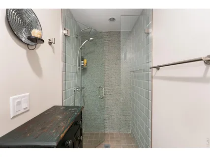 a bathroom with a granite countertop shower mirror and a sink