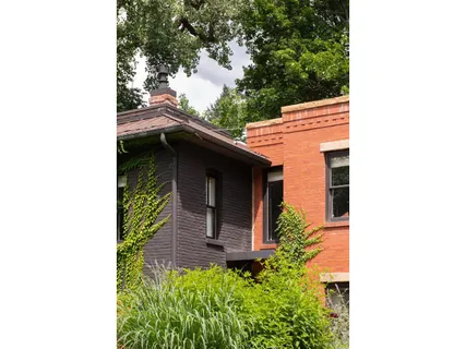 a aerial view of a house with a yard