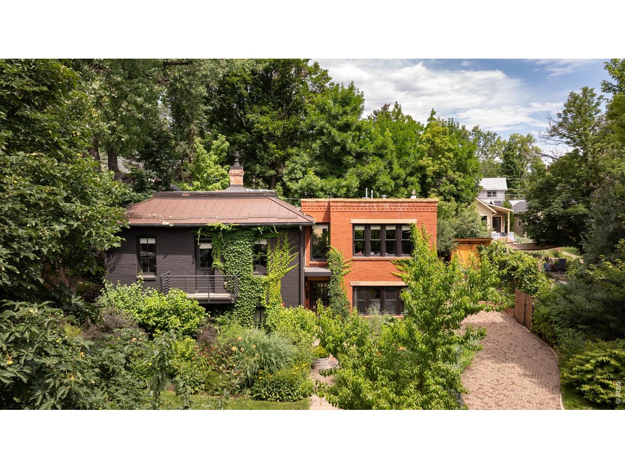 615 Spruce Street Boulder, CO 80302 - Photo 42 of 49 a view of a house with a yard and sitting area