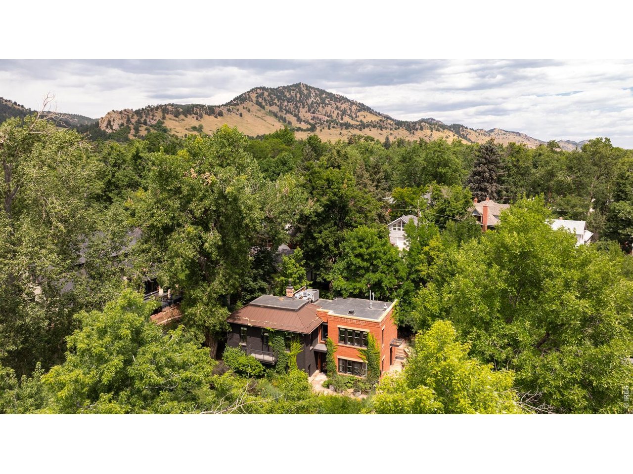 615 Spruce Street Boulder, CO 80302 - Photo 44 of 49 a aerial view of a house with a yard lake and mountain view in back