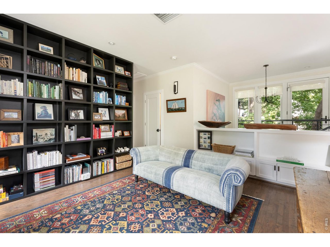 615 Spruce Street Boulder, CO 80302 - Photo 10 of 49 a living room with furniture and a book shelf