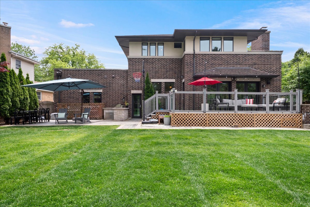 2921 Simpson Street Evanston, IL 60201 - Photo 33 of 41 a view of a house with a swimming pool and sitting area