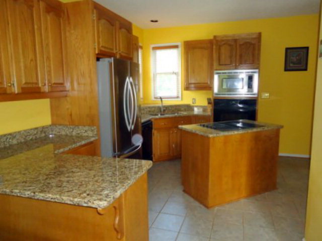 3090 Hamlin Road Lizella, GA 31052 - Photo 2 of 18 a kitchen with stainless steel appliances granite countertop a sink stove and refrigerator