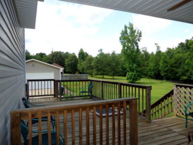 3090 Hamlin Road Lizella, GA 31052 - Photo 13 of 18 a view of a wooden roof deck