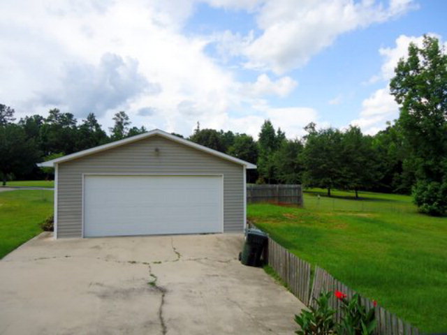 3090 Hamlin Road Lizella, GA 31052 - Photo 14 of 18 a view of backyard of house with green space