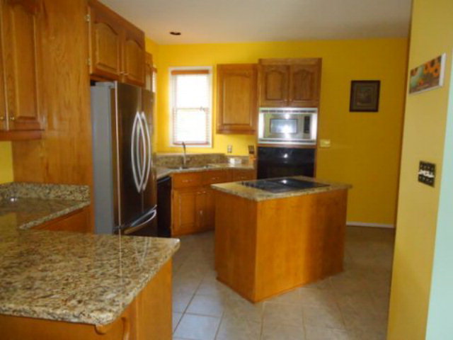 3090 Hamlin Road Lizella, GA 31052 - Photo 3 of 18 a kitchen with stainless steel appliances granite countertop a sink stove and refrigerator