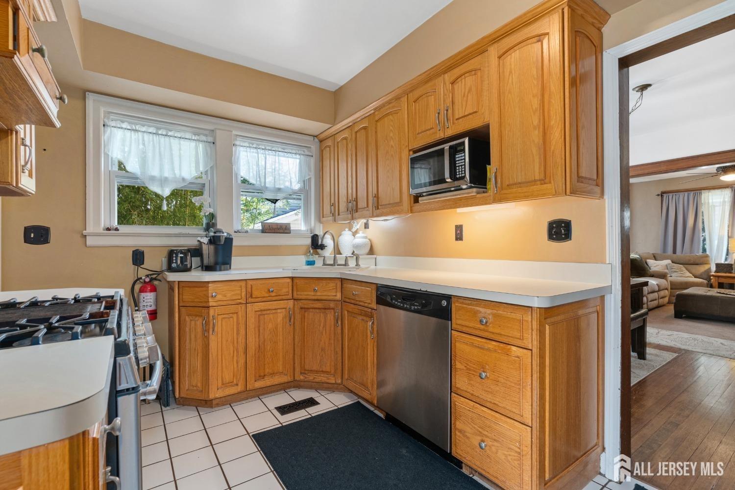 23 Reed Street Edison, NJ 08817 - Photo 9 of 21 a kitchen with stainless steel appliances a sink stove and cabinets