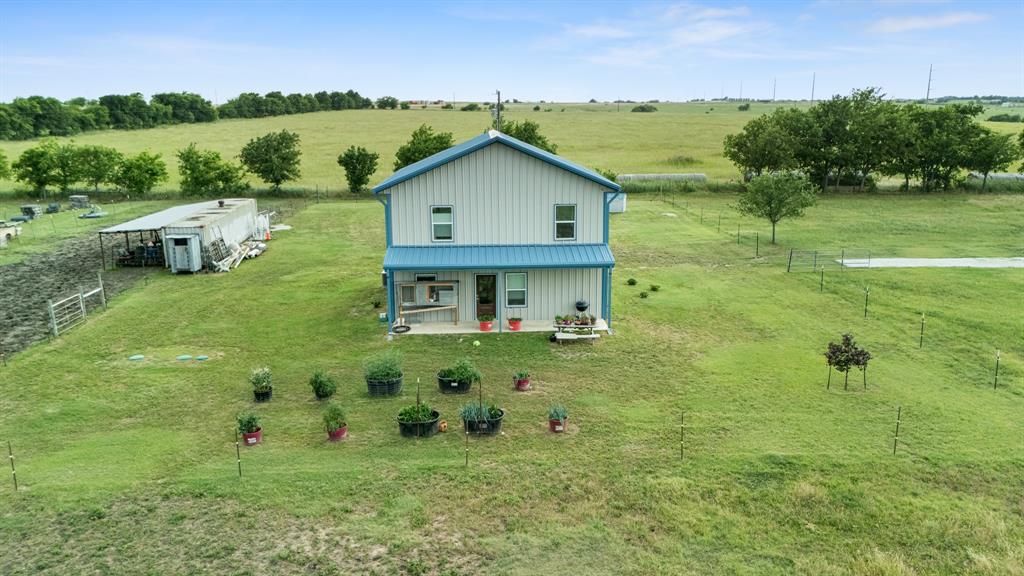 124 County Road 4511 Decatur, TX 76234 - Photo 2 of 39 a view of a house with a backyard