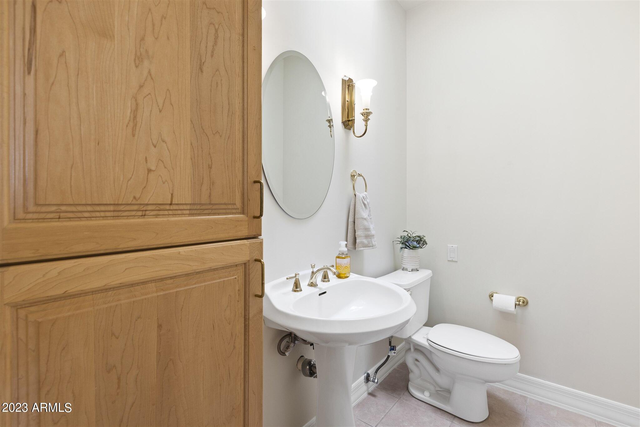155 North Riata Street Gilbert, AZ 85234 - Photo 34 of 63 Powder Room by Kitchen