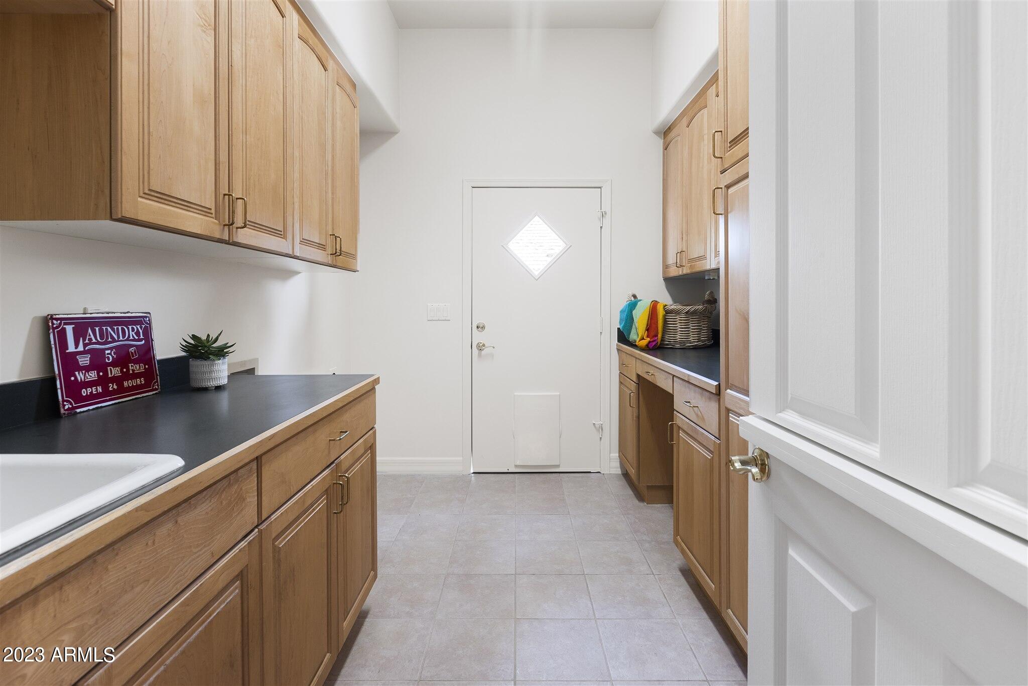 155 North Riata Street Gilbert, AZ 85234 - Photo 35 of 63 French Door to Laundry Room