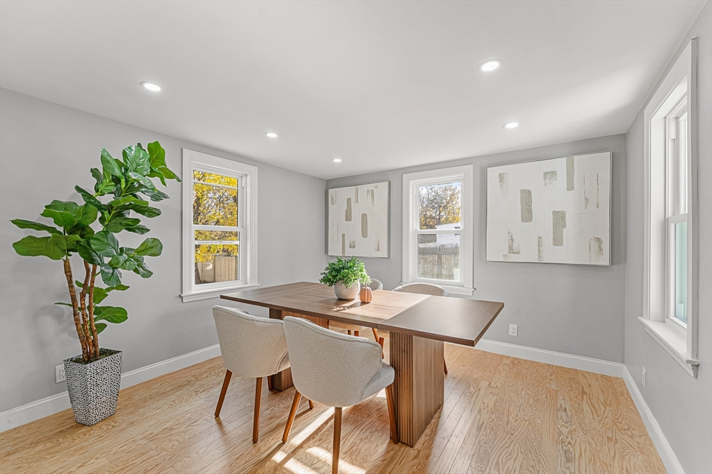 7 Webster Street Randolph, MA 02368 - Photo 12 of 32 a dining room with furniture and wooden floor