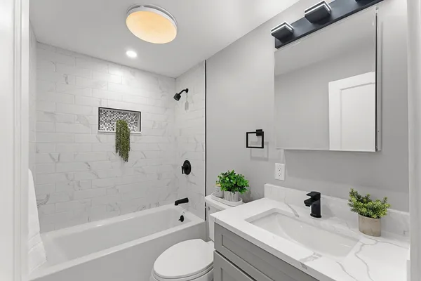a bathroom with a sink and bathtub