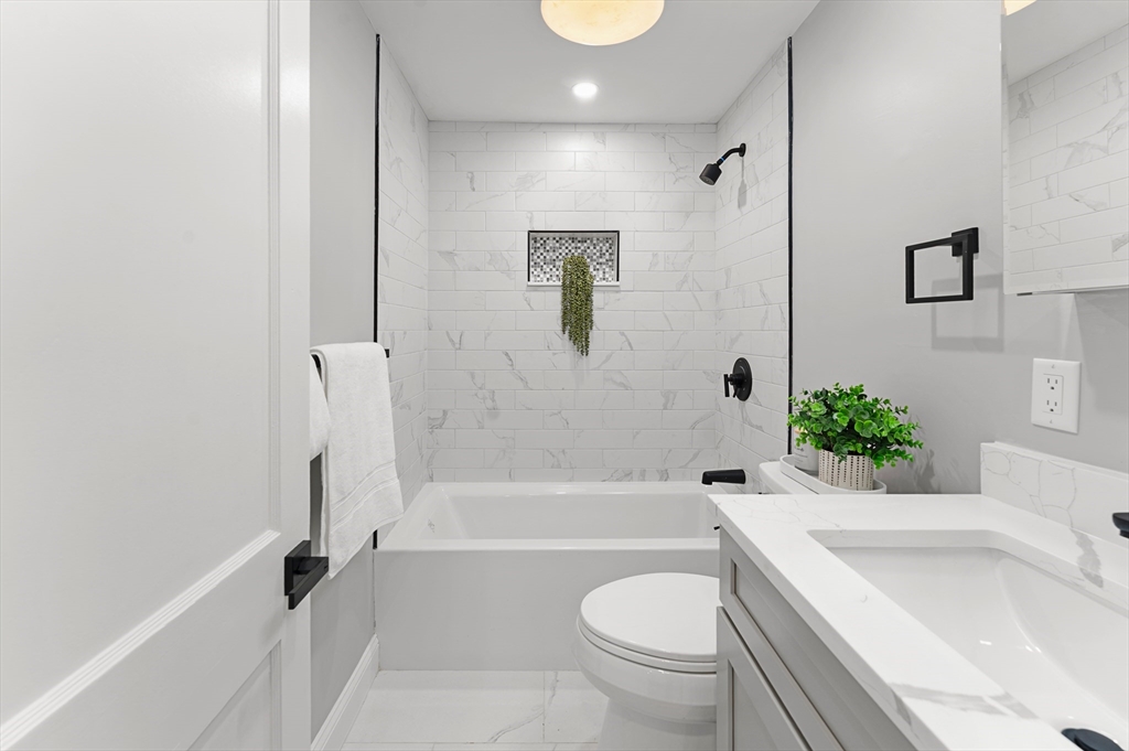 7 Webster Street Randolph, MA 02368 - Photo 15 of 32 a bathroom with a sink toilet and bathtub