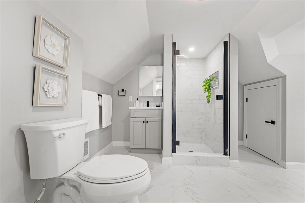 7 Webster Street Randolph, MA 02368 - Photo 22 of 32 a bathroom with a toilet a sink and shower