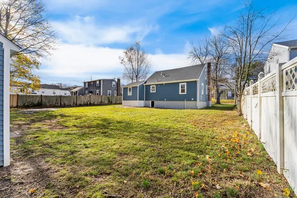 a view of a house with a yard