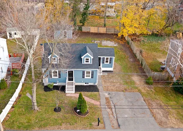 a aerial view of a house with swimming pool