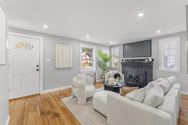 a living room with furniture and a fireplace