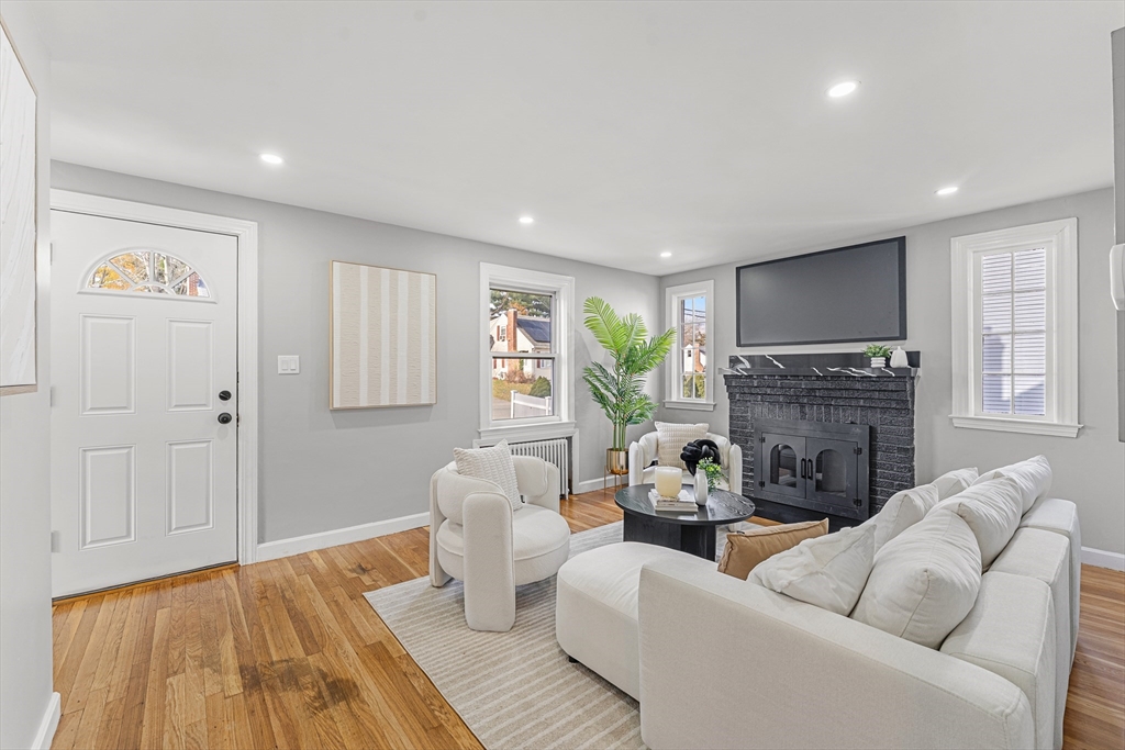 7 Webster Street Randolph, MA 02368 - Photo 5 of 32 a living room with furniture and a fireplace