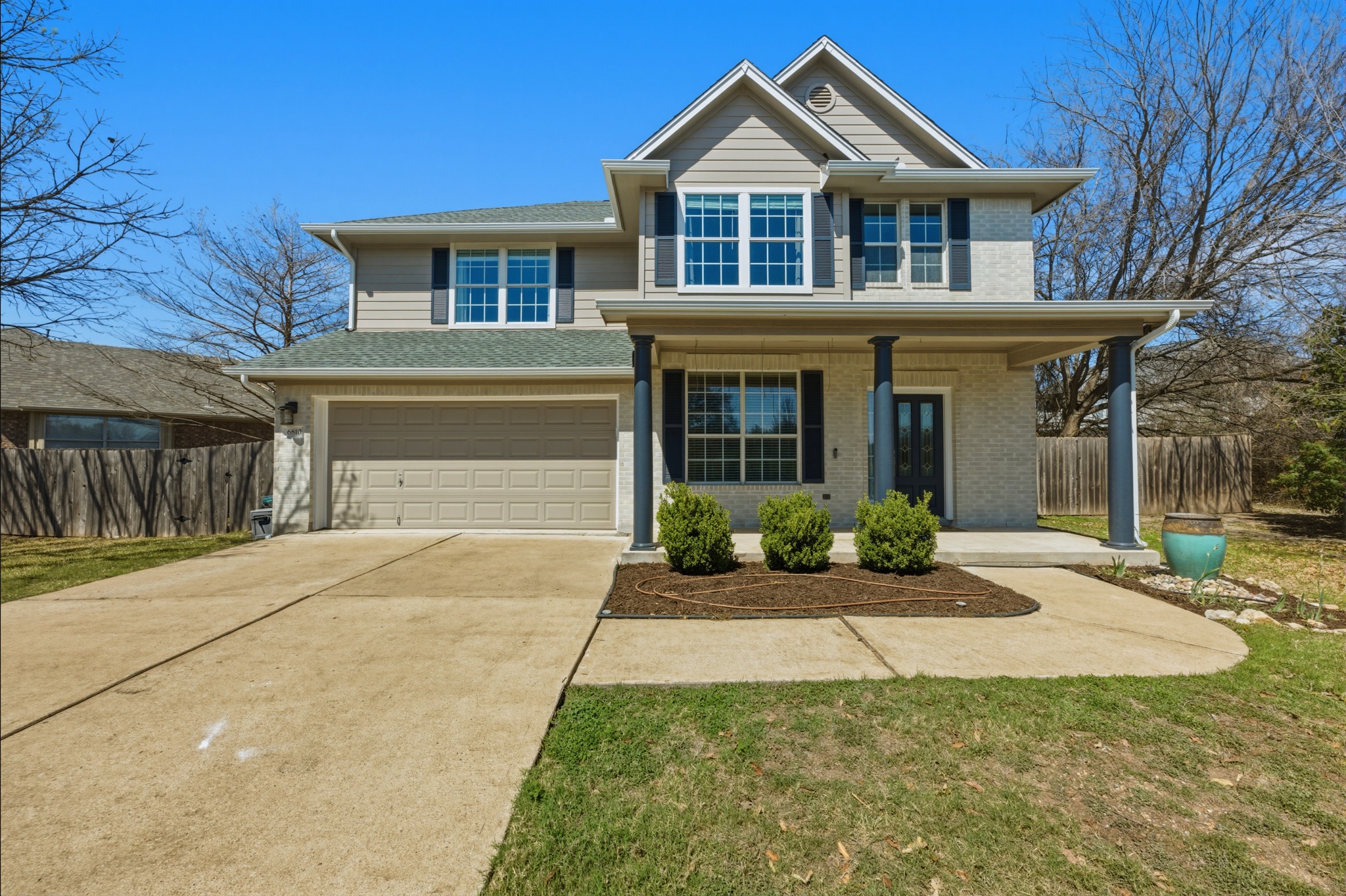 6810 Poncha Pass Austin, TX 78736 - Photo 1 of 35 a front view of a house with yard