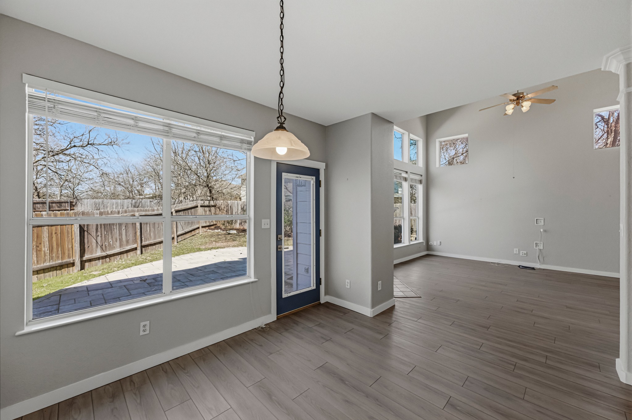 6810 Poncha Pass Austin, TX 78736 - Photo 18 of 35 a view of an empty room with wooden floor and a window
