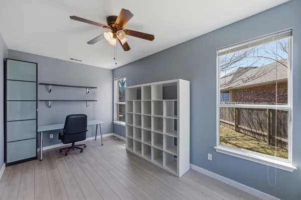 a view of workspace with furniture and windows