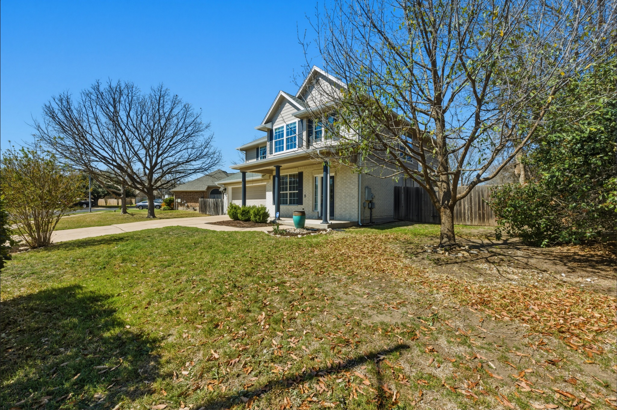 6810 Poncha Pass Austin, TX 78736 - Photo 2 of 35 a front view of a house with a yard