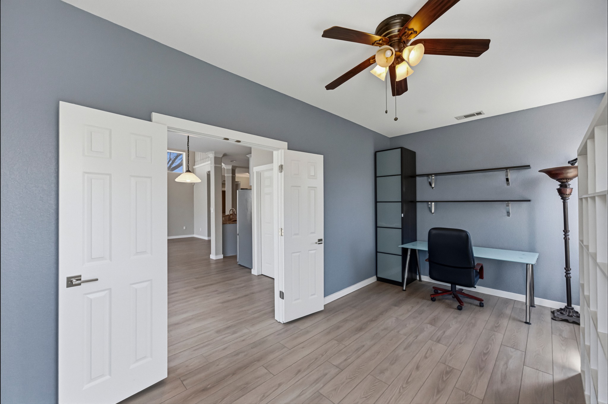 6810 Poncha Pass Austin, TX 78736 - Photo 21 of 35 a view of a workspace with furniture and a ceiling fan