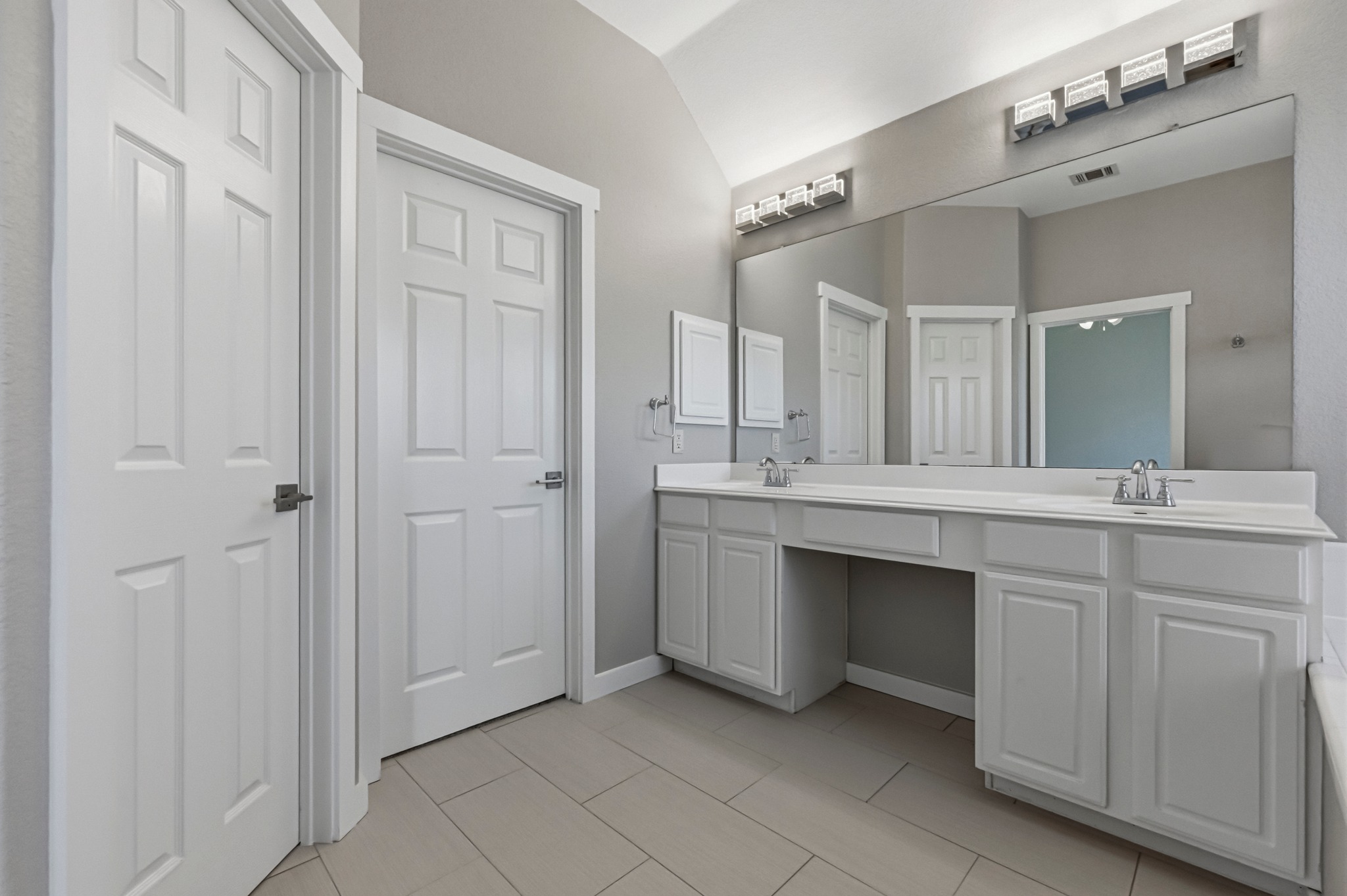 6810 Poncha Pass Austin, TX 78736 - Photo 24 of 35 a bathroom with a double vanity sink and a mirror