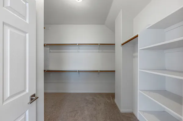 a view of an empty walk in closet