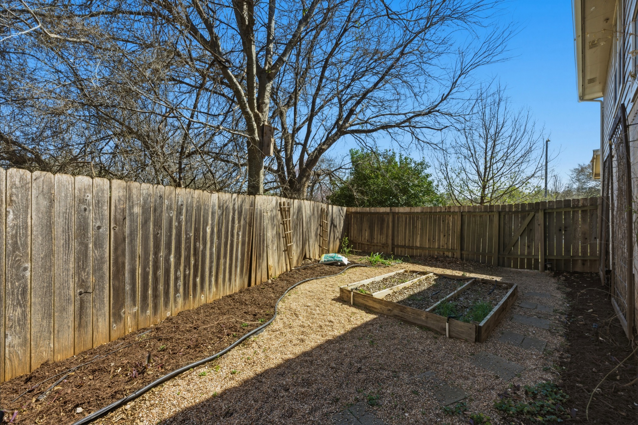 6810 Poncha Pass Austin, TX 78736 - Photo 34 of 35 a garden view with wooden fence