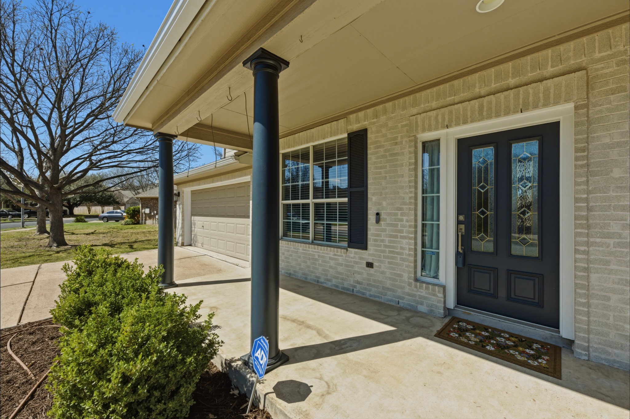 6810 Poncha Pass Austin, TX 78736 - Photo 4 of 35 a front view of a house with a yard