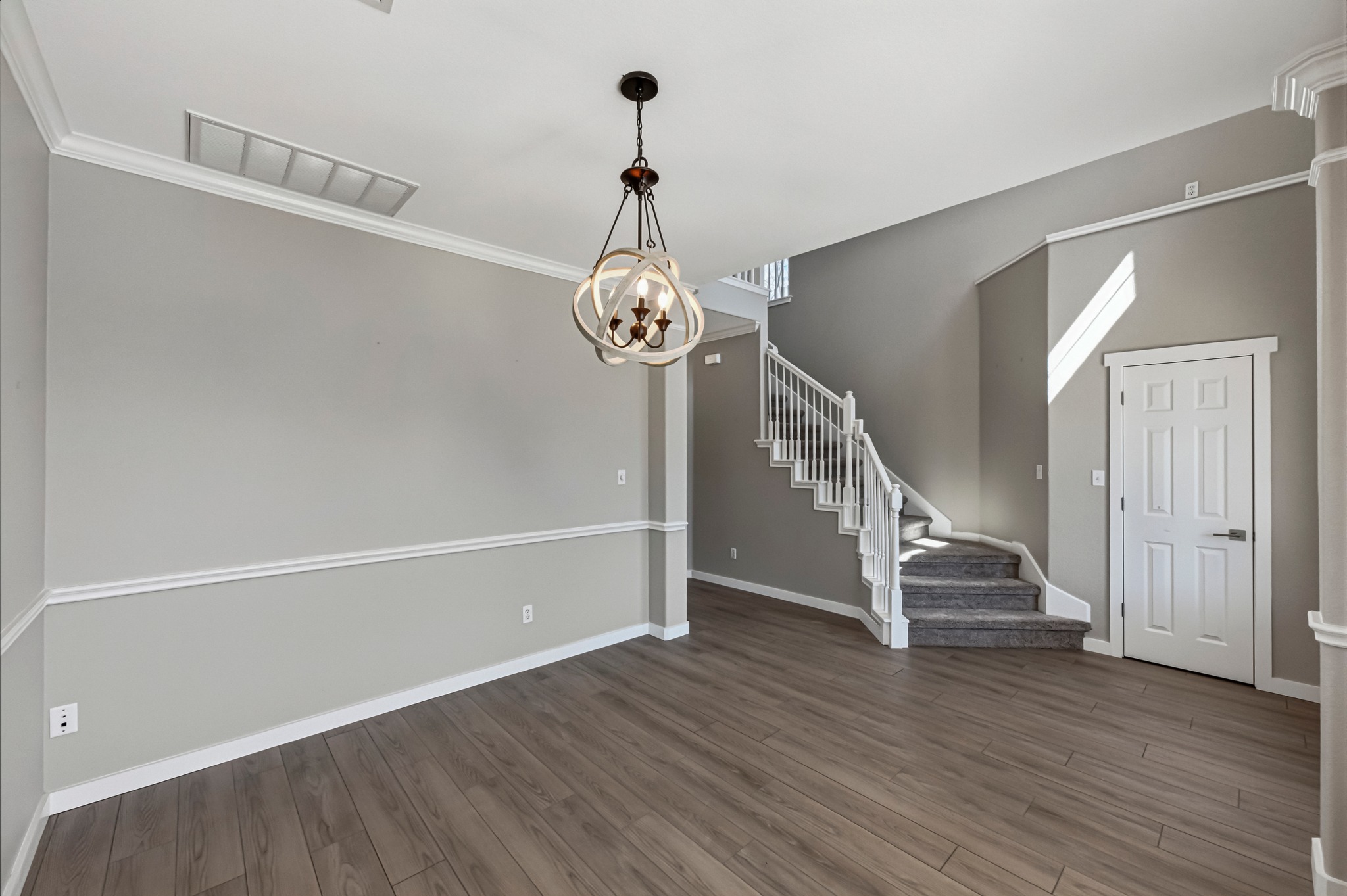 6810 Poncha Pass Austin, TX 78736 - Photo 6 of 35 a view of a hallway with wooden floor and staircase