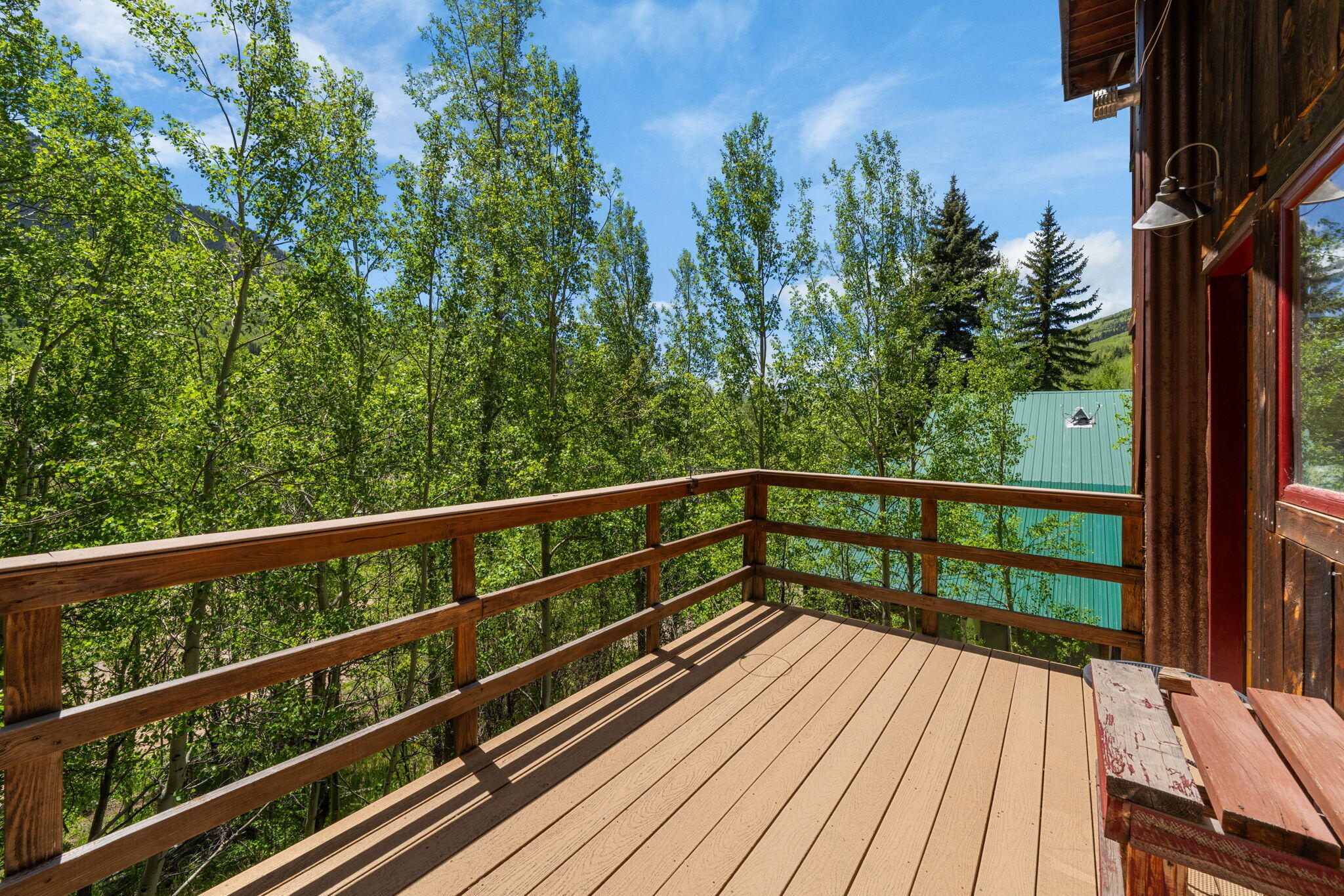 313 North Piedmont Street Rico, CO 81332 - Photo 35 of 43 a view of balcony with wooden floor and fence