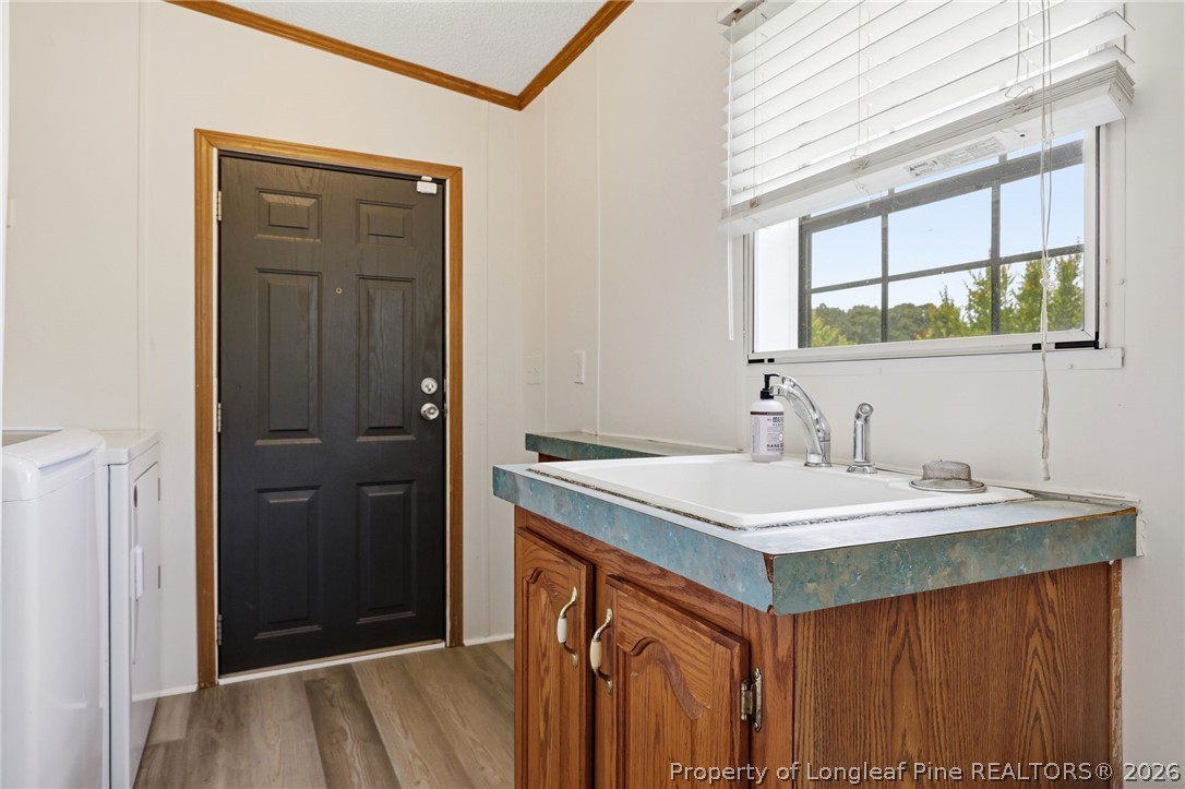10400 Ruth Vinson Road Autryville, NC 28318 - Photo 30 of 49 a view of a sink and a mirror