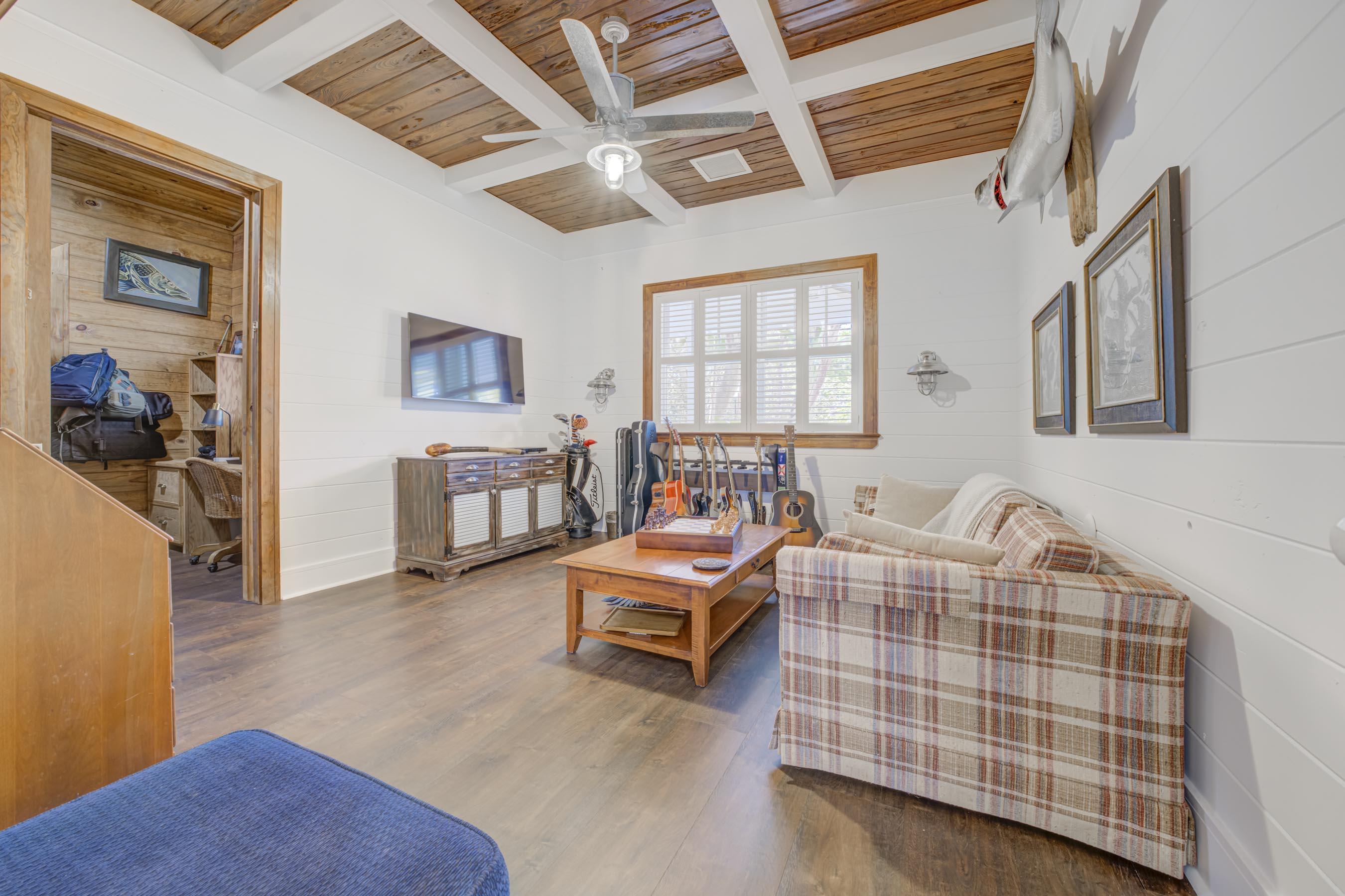 5270 Pennock Point Road Jupiter, FL 33458 - Photo 14 of 60 a bedroom with furniture and a wooden floor