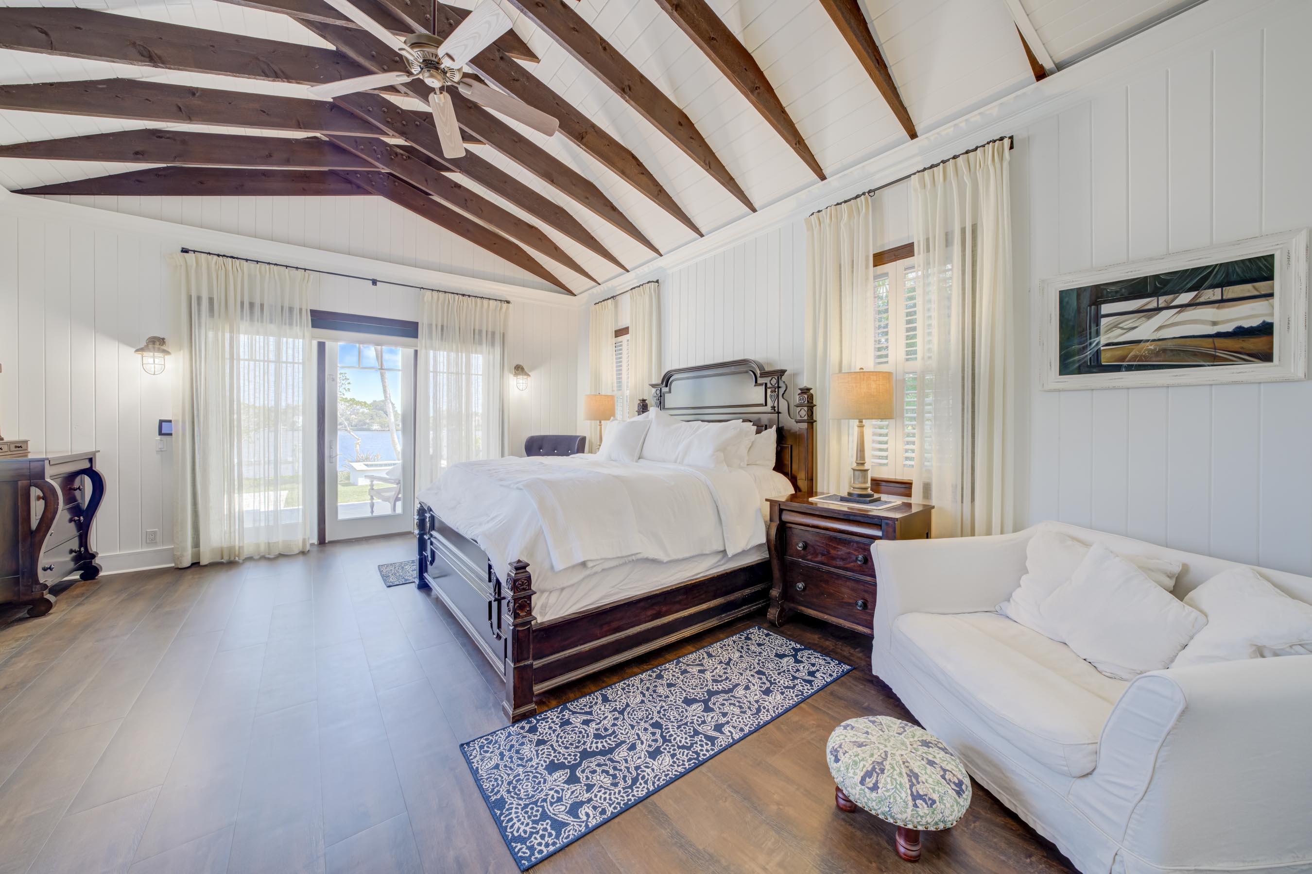 5270 Pennock Point Road Jupiter, FL 33458 - Photo 19 of 60 a bedroom with a bed and a couch