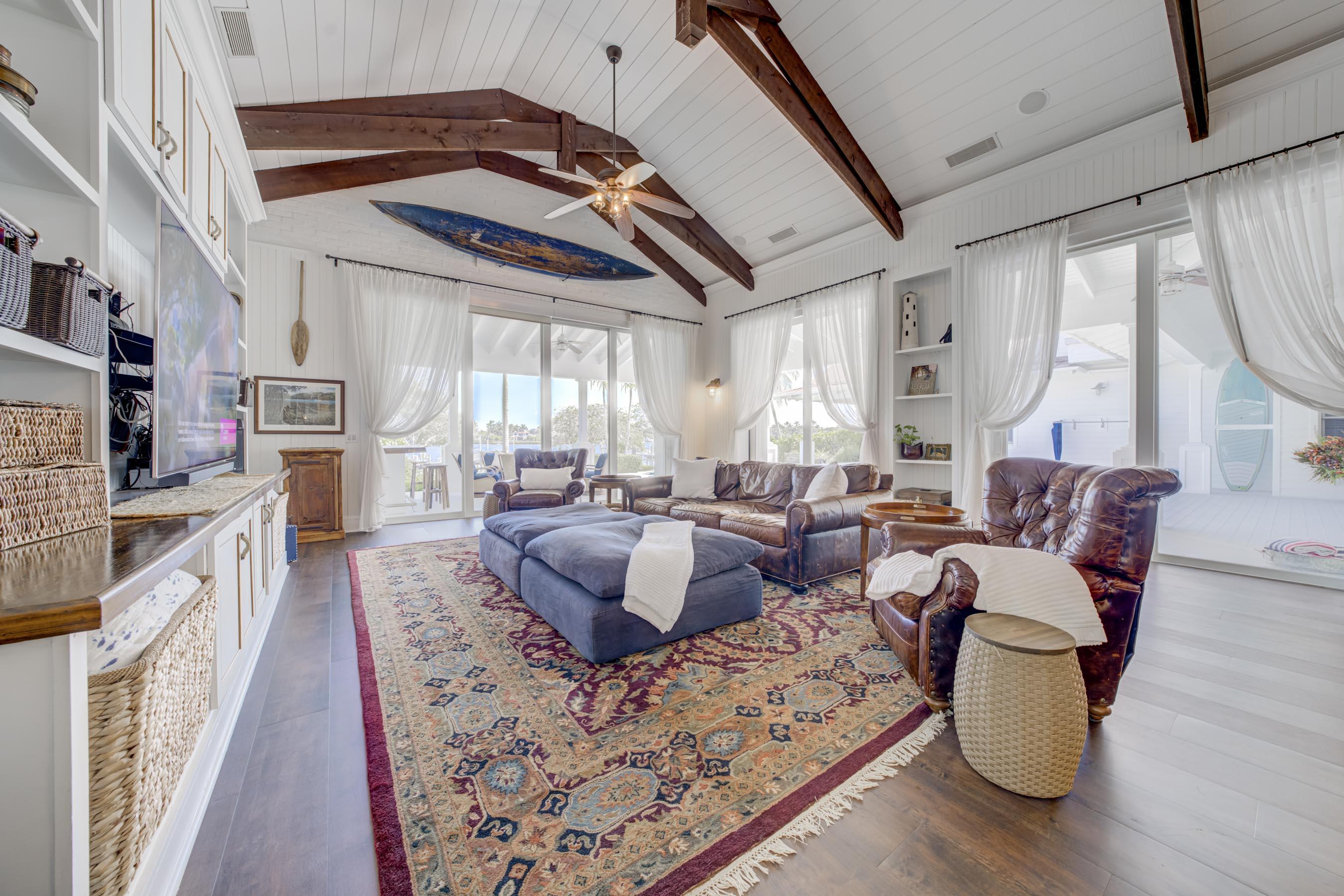 5270 Pennock Point Road Jupiter, FL 33458 - Photo 30 of 60 a living room with furniture and a fireplace