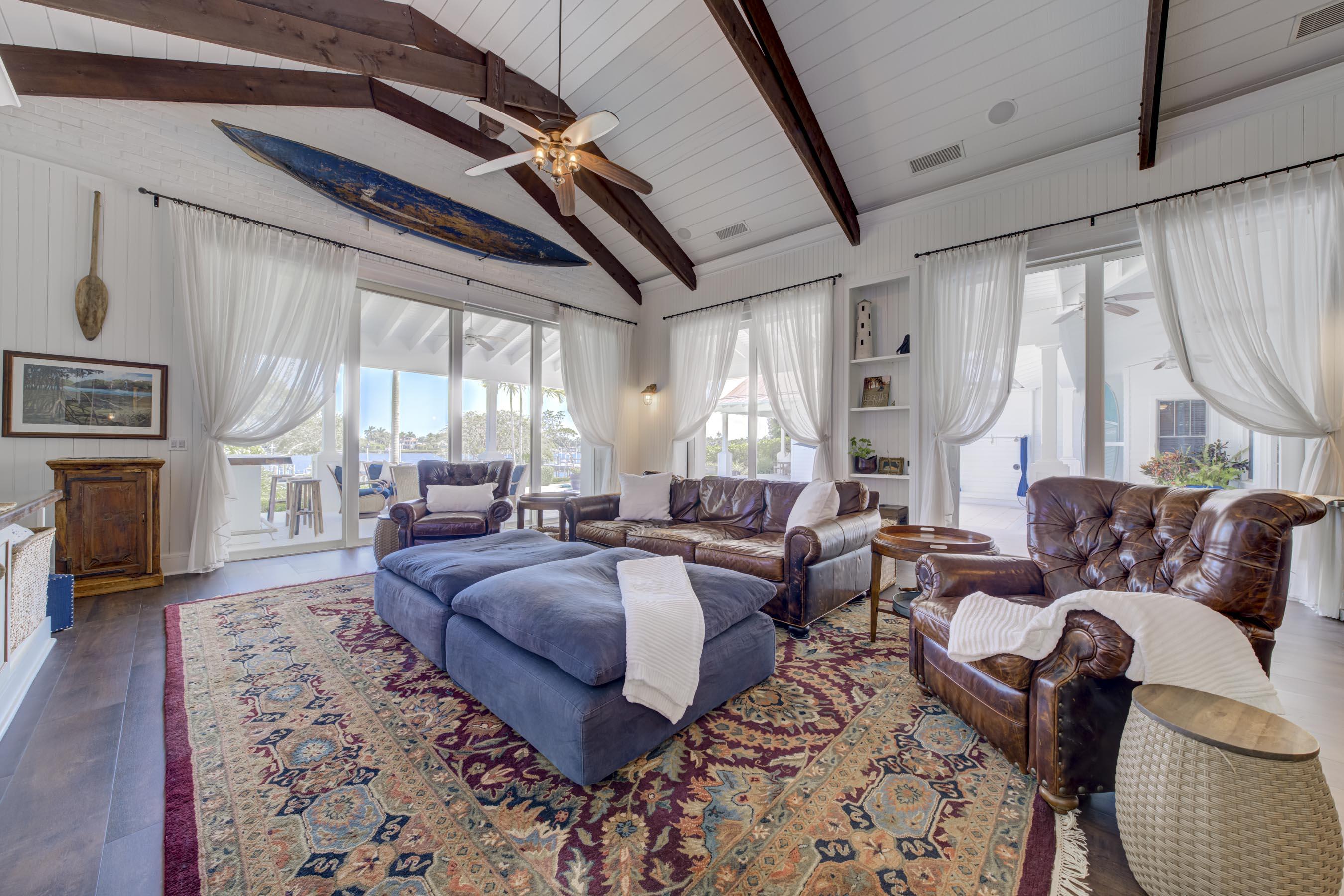 5270 Pennock Point Road Jupiter, FL 33458 - Photo 31 of 60 a living room with furniture a large window and a rug