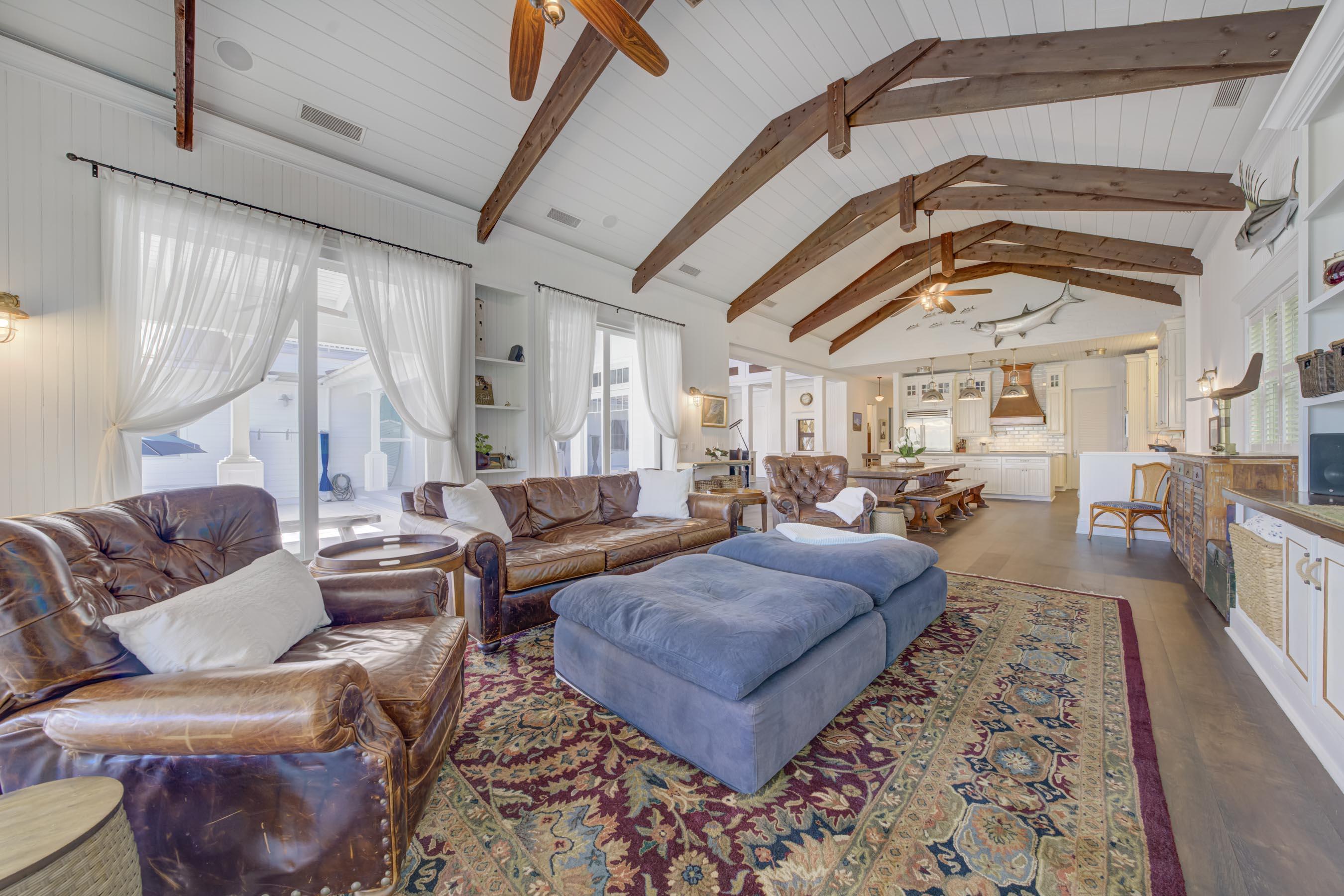 5270 Pennock Point Road Jupiter, FL 33458 - Photo 32 of 60 a living room with furniture and a large window