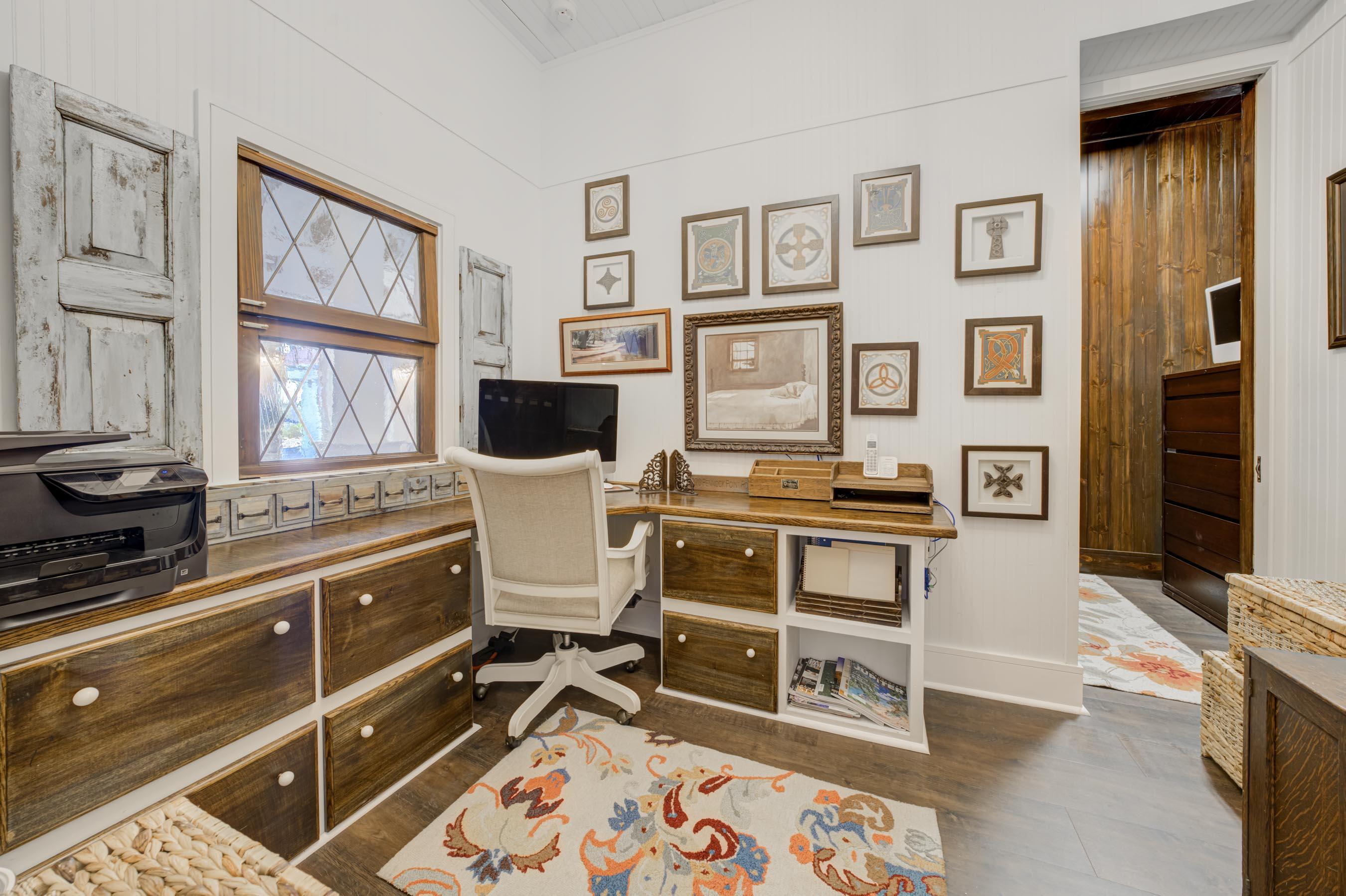 5270 Pennock Point Road Jupiter, FL 33458 - Photo 34 of 60 a view of a workspace with furniture and a window