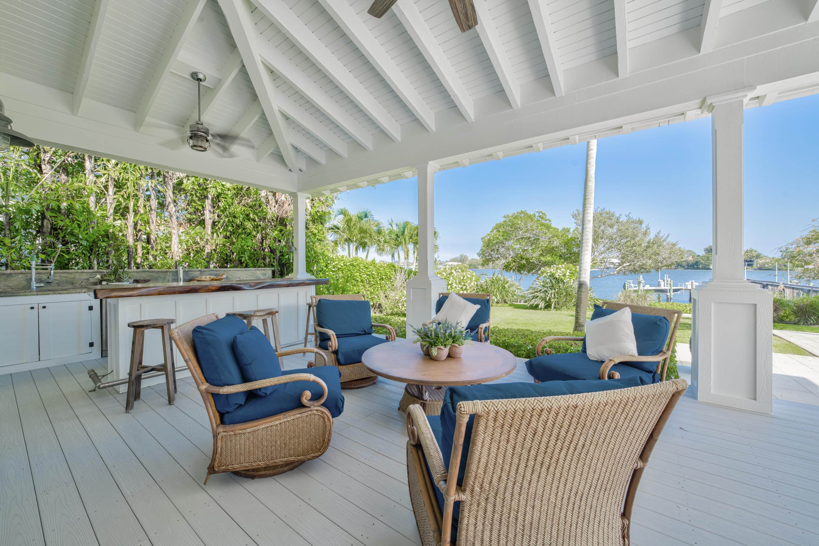 5270 Pennock Point Road Jupiter, FL 33458 - Photo 50 of 60 a outdoor living space with furniture and garden view
