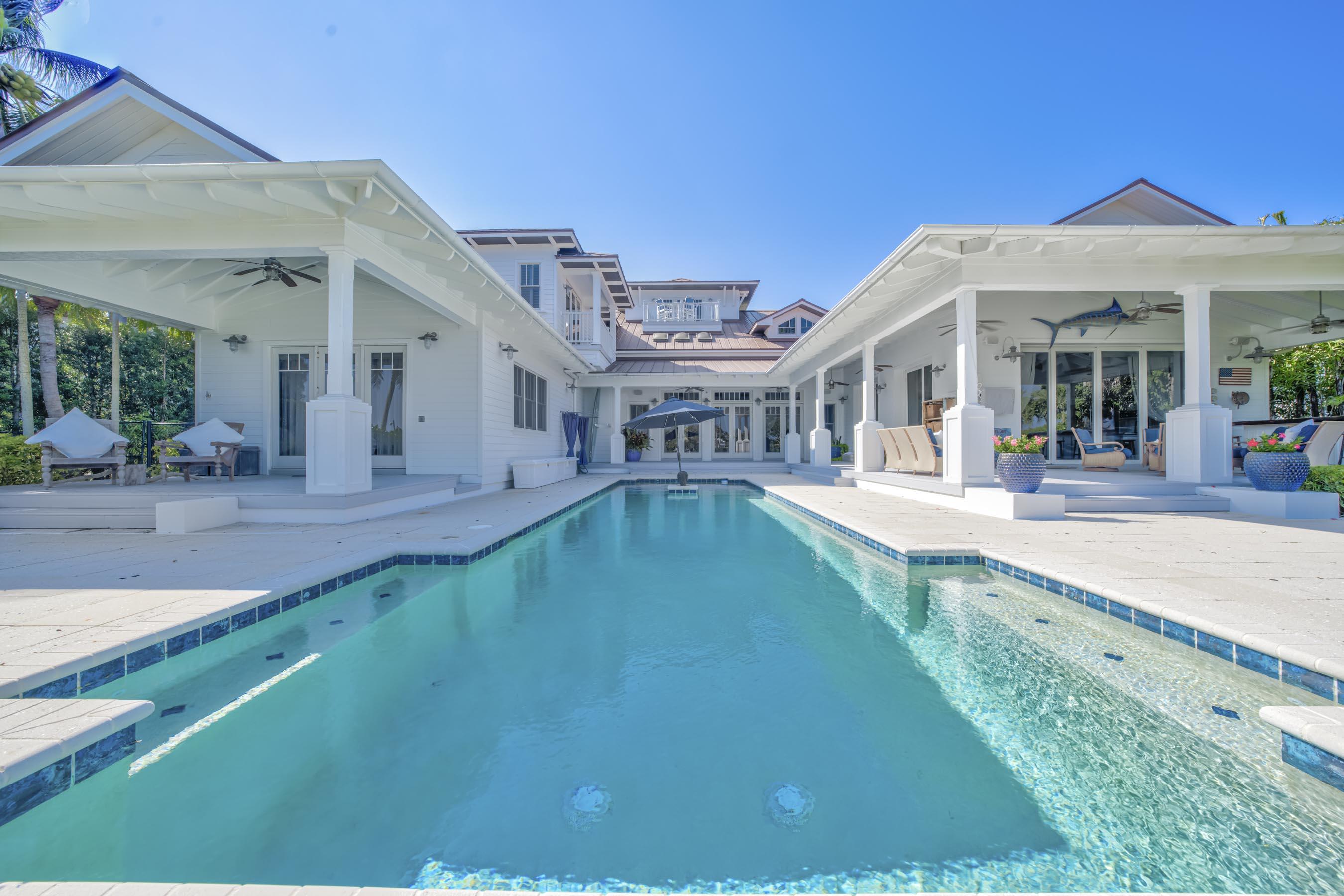 5270 Pennock Point Road Jupiter, FL 33458 - Photo 51 of 60 a view of a patio with swimming pool table and chairs